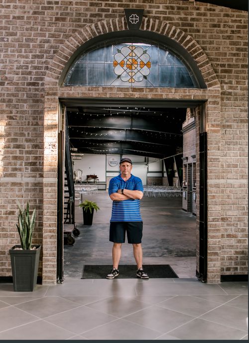 A brick archway and historic doorway in the Rail District.