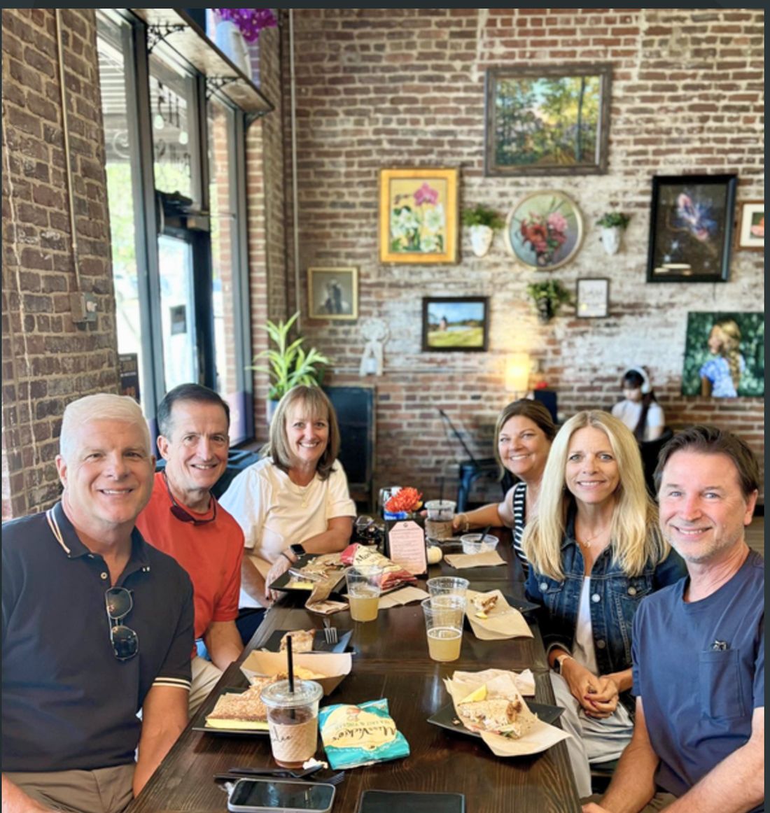 A group sharing a meal together at the table.