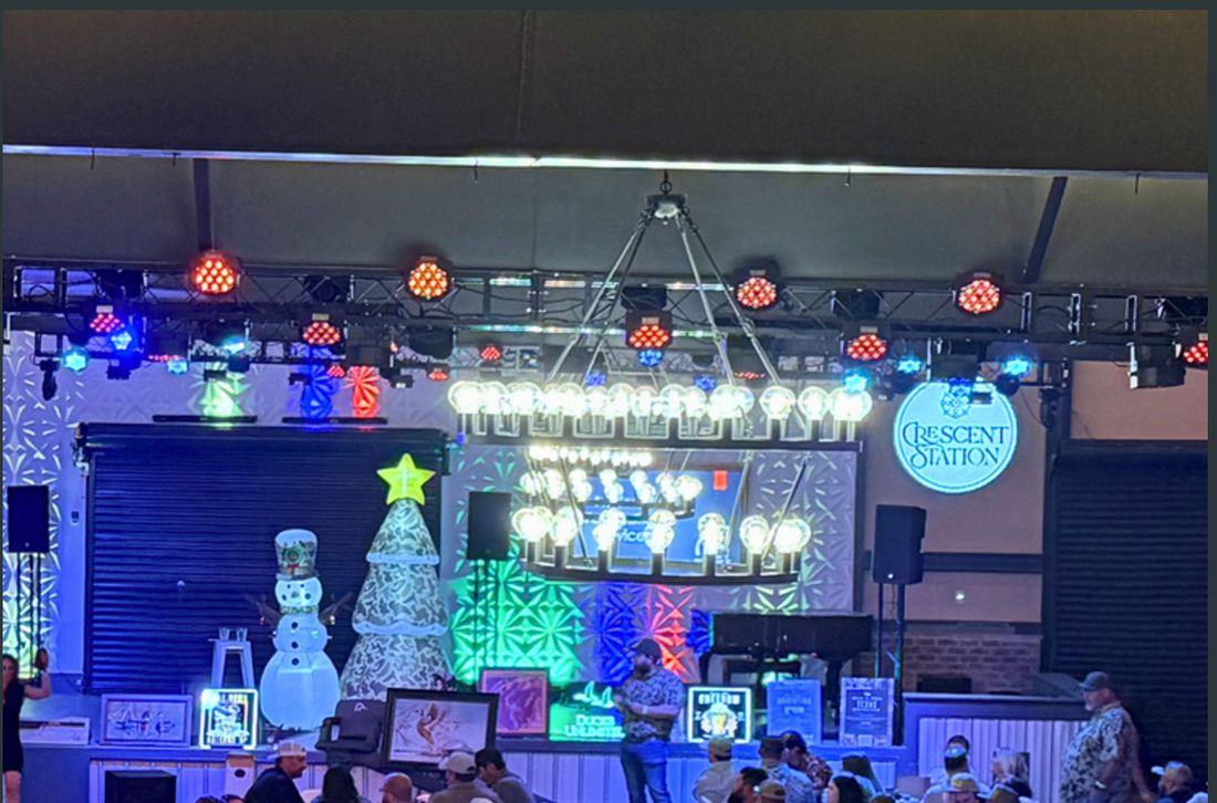 An event floor strung with string lights at a GATHER venue.