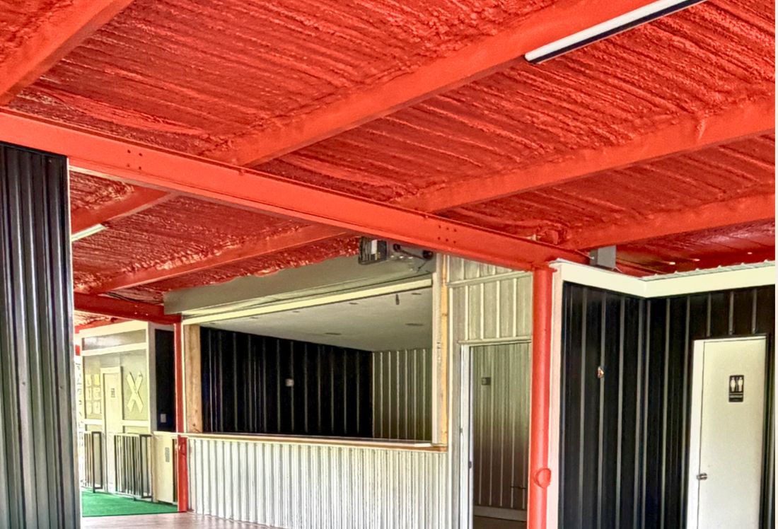 Platform 32’s open venue interior beneath a red ceiling.