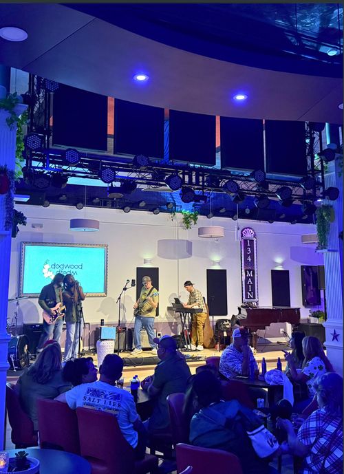 A live music stage lit for a performance.