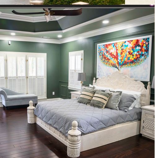 A green-walled bedroom suite at a Youtopia Escapes property.